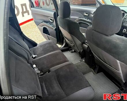 Черный Мицубиси Аутлендер, объемом двигателя 2.4 л и пробегом 200 тыс. км за 9999 $, фото 6 на Automoto.ua