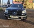 Черный Мицубиси Аутлендер, объемом двигателя 2 л и пробегом 243 тыс. км за 6200 $, фото 6 на Automoto.ua