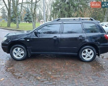 Чорний Міцубісі Аутлендер, об'ємом двигуна 2 л та пробігом 191 тис. км за 7100 $, фото 6 на Automoto.ua