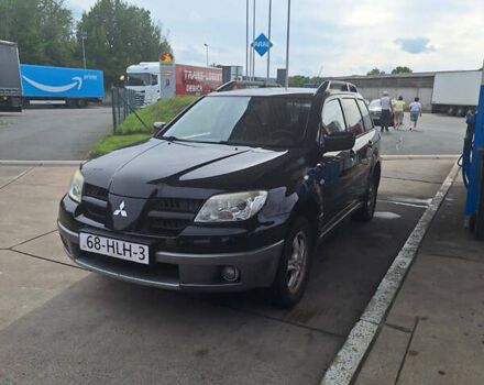 Чорний Міцубісі Аутлендер, об'ємом двигуна 2 л та пробігом 254 тис. км за 7499 $, фото 23 на Automoto.ua