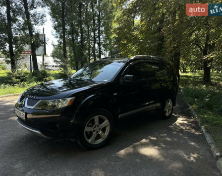 Черный Мицубиси Аутлендер, объемом двигателя 1.97 л и пробегом 265 тыс. км за 9600 $, фото 1 на Automoto.ua