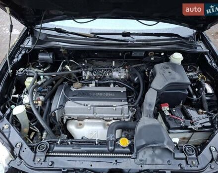 Чорний Міцубісі Аутлендер, об'ємом двигуна 2 л та пробігом 191 тис. км за 7100 $, фото 2 на Automoto.ua