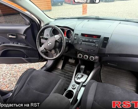 Черный Мицубиси Аутлендер, объемом двигателя 2.4 л и пробегом 200 тыс. км за 9999 $, фото 7 на Automoto.ua