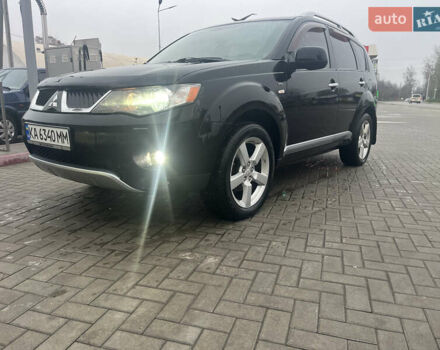 Черный Мицубиси Аутлендер, объемом двигателя 3 л и пробегом 220 тыс. км за 8500 $, фото 1 на Automoto.ua