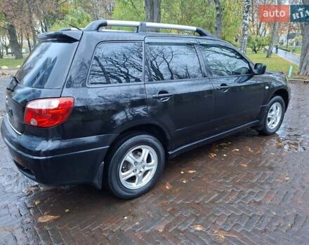 Чорний Міцубісі Аутлендер, об'ємом двигуна 2 л та пробігом 191 тис. км за 7100 $, фото 10 на Automoto.ua
