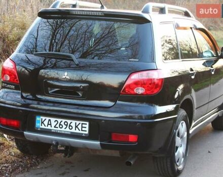 Черный Мицубиси Аутлендер, объемом двигателя 2 л и пробегом 189 тыс. км за 7200 $, фото 13 на Automoto.ua