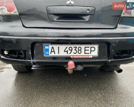 Черный Мицубиси Аутлендер, объемом двигателя 2 л и пробегом 306 тыс. км за 6500 $, фото 19 на Automoto.ua