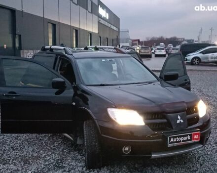 Черный Мицубиси Аутлендер, объемом двигателя 2 л и пробегом 271 тыс. км за 6940 $, фото 22 на Automoto.ua