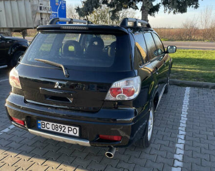 Чорний Міцубісі Аутлендер, об'ємом двигуна 2 л та пробігом 218 тис. км за 6300 $, фото 2 на Automoto.ua