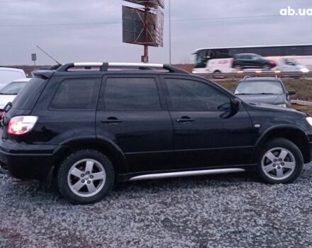 Черный Мицубиси Аутлендер, объемом двигателя 2 л и пробегом 271 тыс. км за 6940 $, фото 9 на Automoto.ua