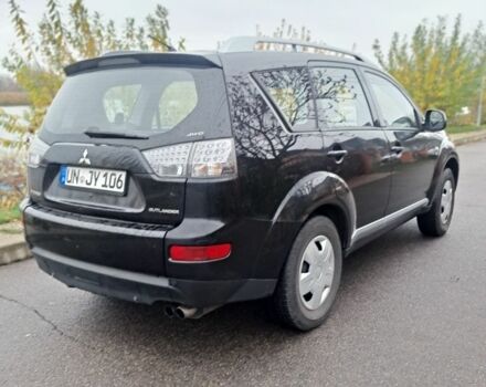 Черный Мицубиси Аутлендер, объемом двигателя 2 л и пробегом 226 тыс. км за 4700 $, фото 4 на Automoto.ua