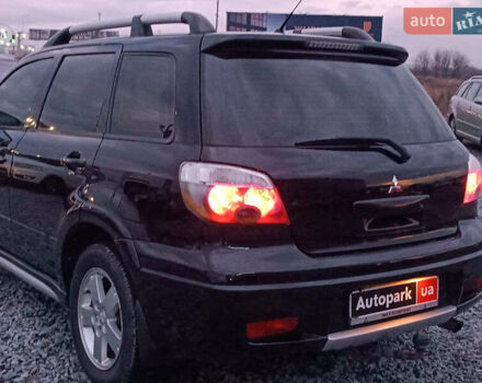 Чорний Міцубісі Аутлендер, об'ємом двигуна 2 л та пробігом 271 тис. км за 6940 $, фото 6 на Automoto.ua