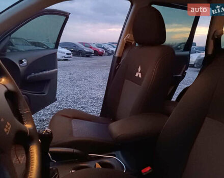 Чорний Міцубісі Аутлендер, об'ємом двигуна 2 л та пробігом 271 тис. км за 6940 $, фото 31 на Automoto.ua