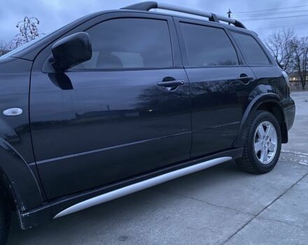 Чорний Міцубісі Аутлендер, об'ємом двигуна 2 л та пробігом 271 тис. км за 6799 $, фото 1 на Automoto.ua