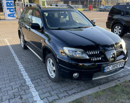 Чорний Міцубісі Аутлендер, об'ємом двигуна 2 л та пробігом 218 тис. км за 6300 $, фото 1 на Automoto.ua