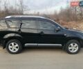 Черный Мицубиси Аутлендер, объемом двигателя 2.4 л и пробегом 290 тыс. км за 8600 $, фото 3 на Automoto.ua