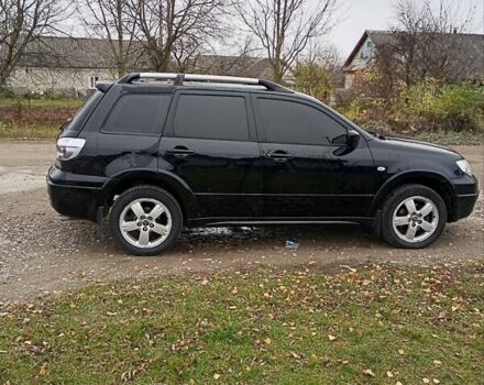 Черный Мицубиси Аутлендер, объемом двигателя 2 л и пробегом 209 тыс. км за 5700 $, фото 9 на Automoto.ua