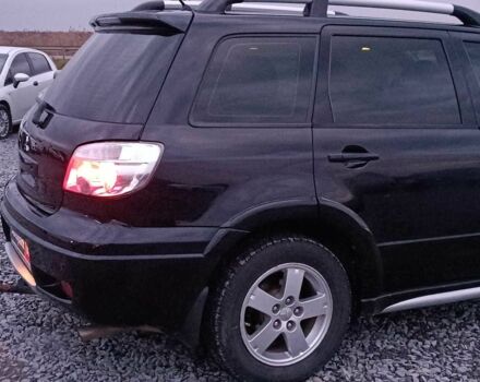 Черный Мицубиси Аутлендер, объемом двигателя 2 л и пробегом 271 тыс. км за 6940 $, фото 8 на Automoto.ua