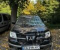 Черный Мицубиси Аутлендер, объемом двигателя 2 л и пробегом 136 тыс. км за 2550 $, фото 1 на Automoto.ua