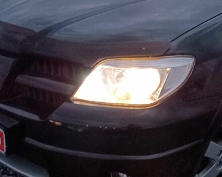 Черный Мицубиси Аутлендер, объемом двигателя 2 л и пробегом 271 тыс. км за 6940 $, фото 2 на Automoto.ua