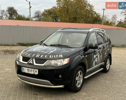 Черный Мицубиси Аутлендер, объемом двигателя 2.4 л и пробегом 230 тыс. км за 6650 $, фото 4 на Automoto.ua