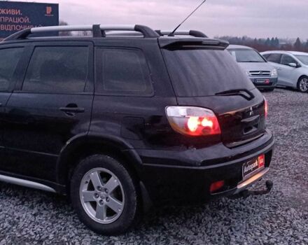Черный Мицубиси Аутлендер, объемом двигателя 2 л и пробегом 271 тыс. км за 6940 $, фото 5 на Automoto.ua