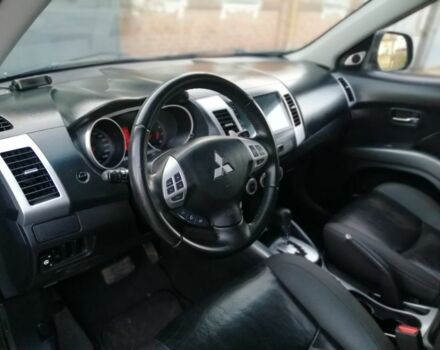 Черный Мицубиси Аутлендер, объемом двигателя 2.4 л и пробегом 228 тыс. км за 7850 $, фото 4 на Automoto.ua