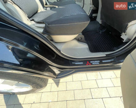 Чорний Міцубісі Аутлендер, об'ємом двигуна 2.4 л та пробігом 195 тис. км за 8600 $, фото 8 на Automoto.ua