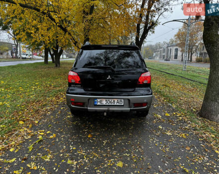 Чорний Міцубісі Аутлендер, об'ємом двигуна 2 л та пробігом 254 тис. км за 7499 $, фото 3 на Automoto.ua