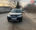 Черный Мицубиси Аутлендер, объемом двигателя 2.4 л и пробегом 290 тыс. км за 8600 $, фото 1 на Automoto.ua