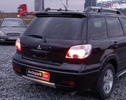 Черный Мицубиси Аутлендер, объемом двигателя 2 л и пробегом 271 тыс. км за 6940 $, фото 7 на Automoto.ua