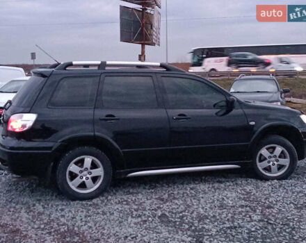 Чорний Міцубісі Аутлендер, об'ємом двигуна 2 л та пробігом 271 тис. км за 6940 $, фото 8 на Automoto.ua