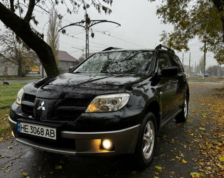 Чорний Міцубісі Аутлендер, об'ємом двигуна 2 л та пробігом 254 тис. км за 7499 $, фото 2 на Automoto.ua
