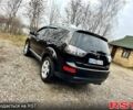 Черный Мицубиси Аутлендер, объемом двигателя 2.4 л и пробегом 229 тыс. км за 9790 $, фото 4 на Automoto.ua