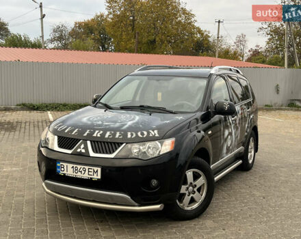 Черный Мицубиси Аутлендер, объемом двигателя 2.4 л и пробегом 230 тыс. км за 6650 $, фото 1 на Automoto.ua
