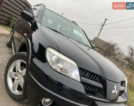 Черный Мицубиси Аутлендер, объемом двигателя 2.4 л и пробегом 178 тыс. км за 6900 $, фото 14 на Automoto.ua