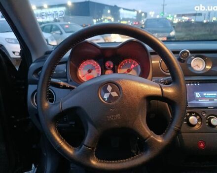 Черный Мицубиси Аутлендер, объемом двигателя 2 л и пробегом 271 тыс. км за 6940 $, фото 24 на Automoto.ua