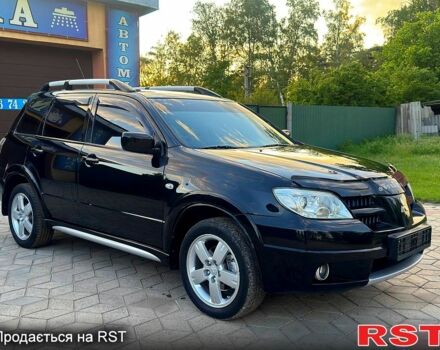 Чорний Міцубісі Аутлендер, об'ємом двигуна 2.4 л та пробігом 159 тис. км за 7300 $, фото 1 на Automoto.ua