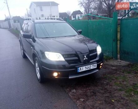 Чорний Міцубісі Аутлендер, об'ємом двигуна 2 л та пробігом 220 тис. км за 5599 $, фото 2 на Automoto.ua