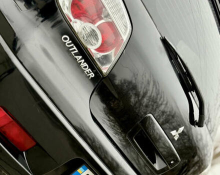 Черный Мицубиси Аутлендер, объемом двигателя 2.4 л и пробегом 245 тыс. км за 6500 $, фото 8 на Automoto.ua