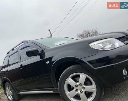 Черный Мицубиси Аутлендер, объемом двигателя 2.4 л и пробегом 178 тыс. км за 6900 $, фото 4 на Automoto.ua
