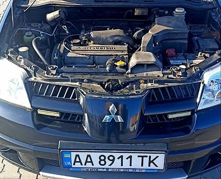 Чорний Міцубісі Аутлендер, об'ємом двигуна 2 л та пробігом 364 тис. км за 5900 $, фото 7 на Automoto.ua