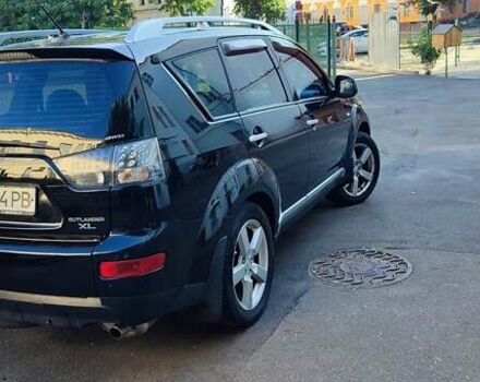 Черный Мицубиси Аутлендер, объемом двигателя 2.36 л и пробегом 246 тыс. км за 9700 $, фото 2 на Automoto.ua