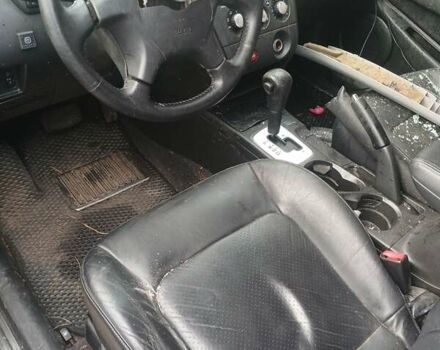 Черный Мицубиси Аутлендер, объемом двигателя 2.38 л и пробегом 270 тыс. км за 1700 $, фото 3 на Automoto.ua