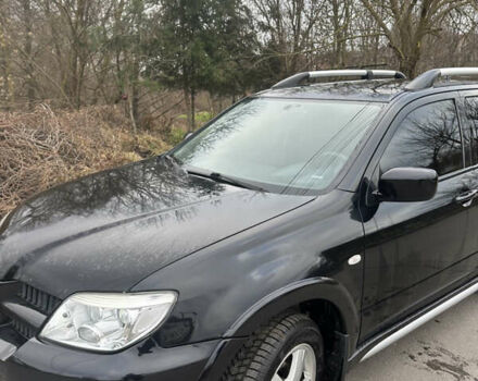 Чорний Міцубісі Аутлендер, об'ємом двигуна 2 л та пробігом 118 тис. км за 8100 $, фото 17 на Automoto.ua