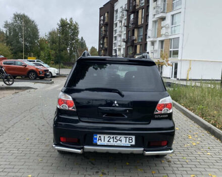 Чорний Міцубісі Аутлендер, об'ємом двигуна 2.38 л та пробігом 252 тис. км за 7200 $, фото 5 на Automoto.ua