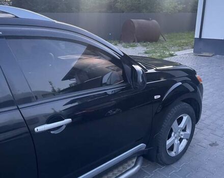 Черный Мицубиси Аутлендер, объемом двигателя 2.4 л и пробегом 290 тыс. км за 9500 $, фото 5 на Automoto.ua