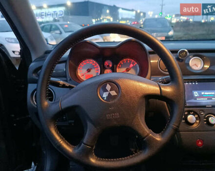 Чорний Міцубісі Аутлендер, об'ємом двигуна 2 л та пробігом 271 тис. км за 6940 $, фото 24 на Automoto.ua