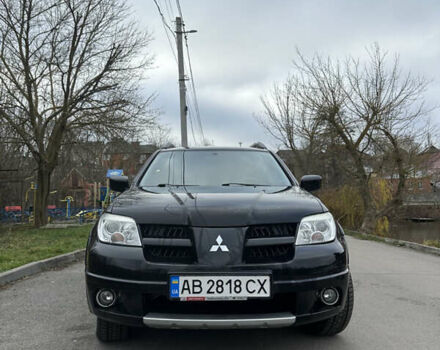 Чорний Міцубісі Аутлендер, об'ємом двигуна 2 л та пробігом 118 тис. км за 8100 $, фото 1 на Automoto.ua