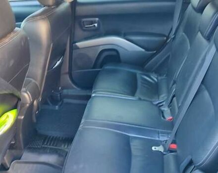 Черный Мицубиси Аутлендер, объемом двигателя 2.36 л и пробегом 246 тыс. км за 9700 $, фото 6 на Automoto.ua